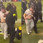 Security-Takes-Down-Commanders-Fan-Who-Ran-Onto-Field-to-Confront-Hogan-Hatten