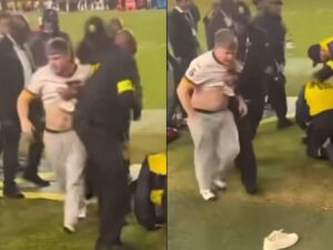 Security-Takes-Down-Commanders-Fan-Who-Ran-Onto-Field-to-Confront-Hogan-Hatten