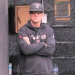 texas-tech-head-coach-tim-tadlock-looks-on-dugout