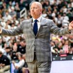 Mick-Cronin-arms-up