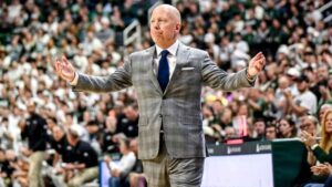 Mick-Cronin-arms-up